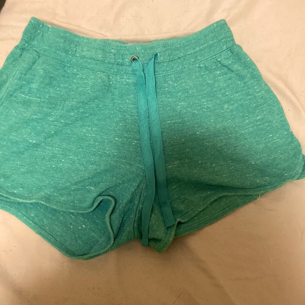 Kelly green shorts, thin material, stretchy